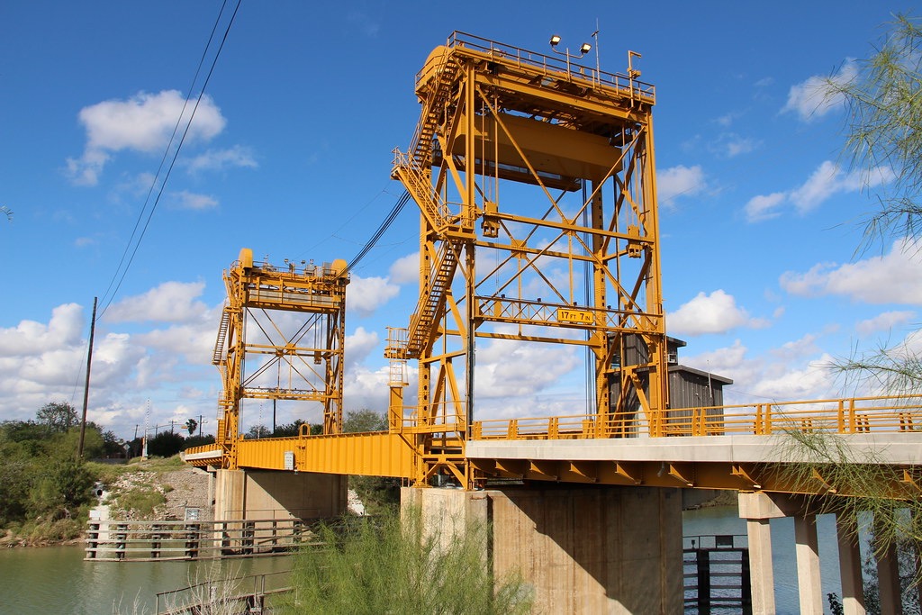 The yellow Rio Hondo lift bridge over the Arroyo Colorado on a clear blue day